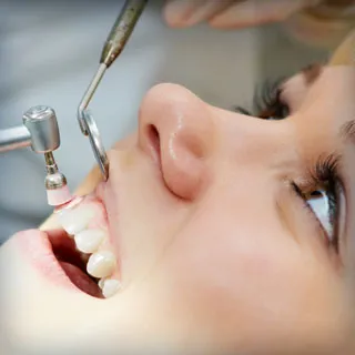 woman having her teeth cleaned